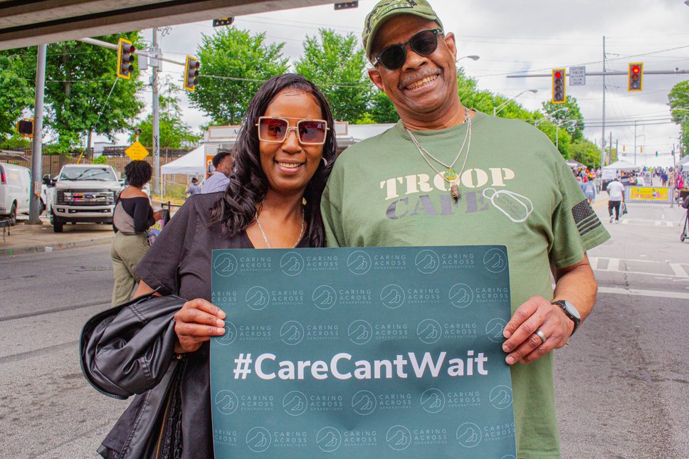 Attendees at Caring Across Generations and The Arc ‐ Georgia’s table at Atlanta’s Sweet Auburn Springfest in May 2022.