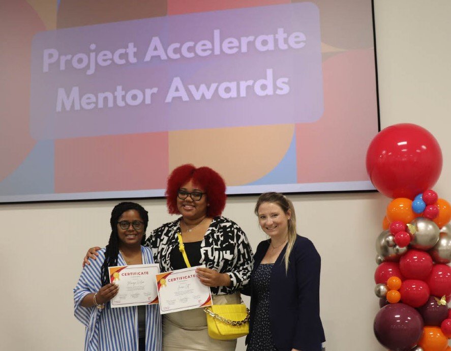 Journi, a Project Accelerate participant from Girls Inc. of Central Alabama, her mentor, and Nichole Morris, College and Career Readiness Manager, being honored at an end-of-year celebration.