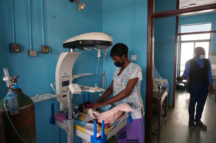 A nurse at University College Hospital in Nigeria uses a phototherapy machine. A phototherapy machine is among NEST’s vital devices for treating sick and small newborns.