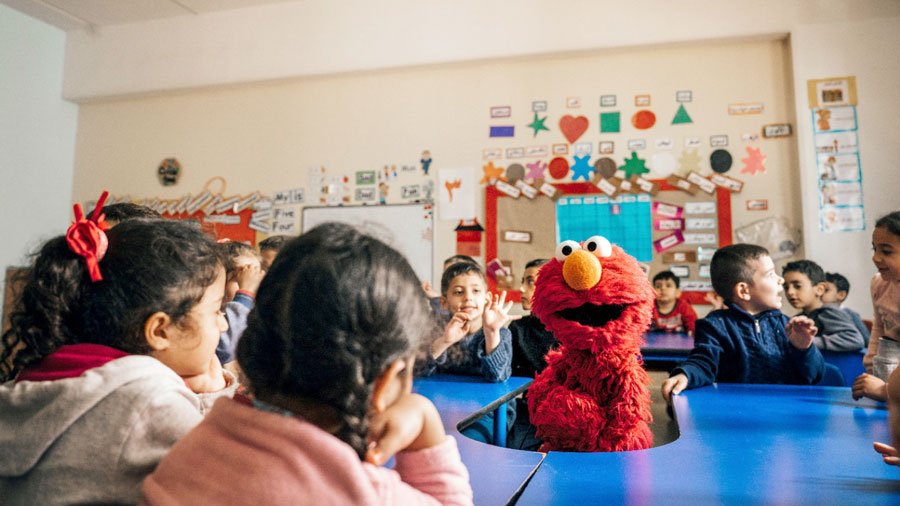 Elmo visits an Ahlan Simsim center in Lebanon.